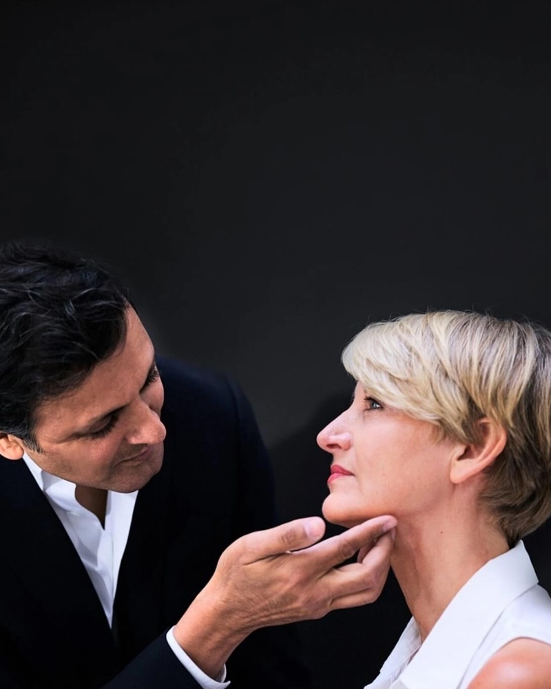 The uk's best facelift surgeon Rajiv Grover examining a facelift patient